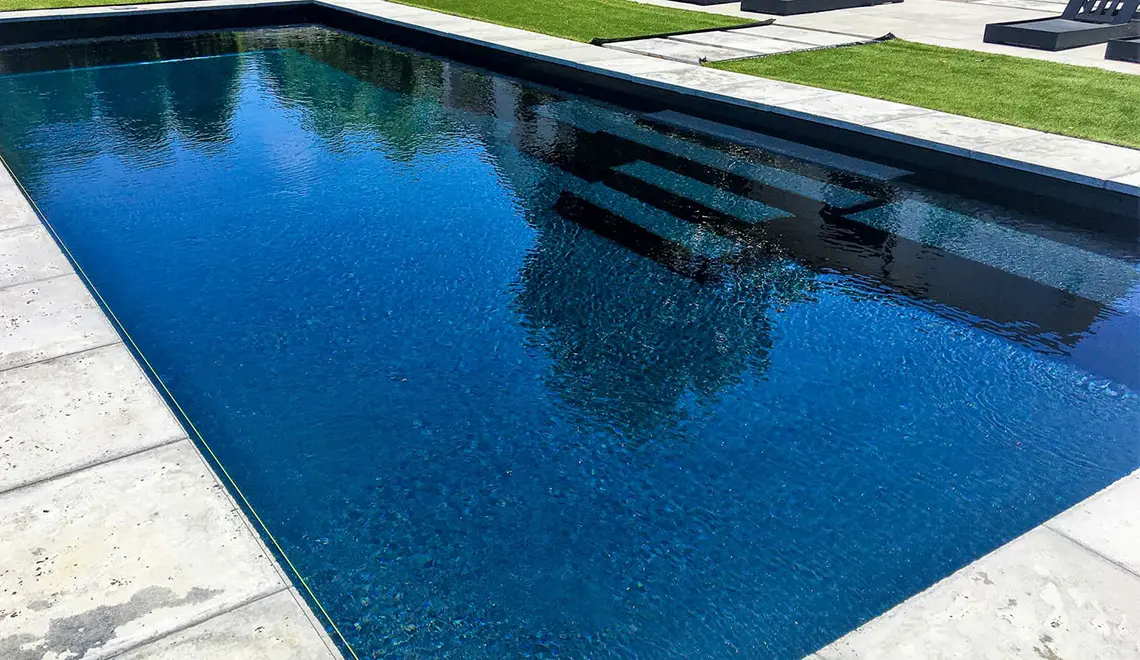 The Grand rectangular fiberglass pool with great side entry steps from Leisure Pools Coastal Mississippi